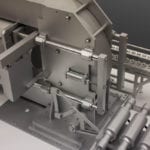 Detail view of the engineering scale model of a Avure HPP high-pressure food processing machine
