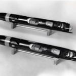 Full view of two engineering scale models of a Honeywell torpedoes showing cutaway panels and hand-made brass screws