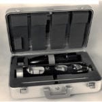 Full view of two engineering scale models of a Honeywell torpedoes in their custom shipping case