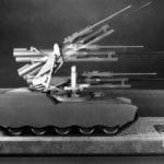 Side view of an engineering scale model of a Paccar self-propelled remote gun on custom shipping case base