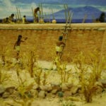 Detail of activity around the wall of the museum scale model of the Tusayan Pueblo