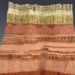 Detail view of the Grand Canyon Geologic Column scale model showing multi-color layers of stone
